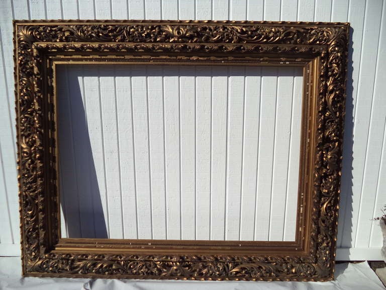 Museum Quality 19th Century Hand-Carved and Gilded Frame.
This once housed a huge portrait in a large mansion outside of NYC. Made of wood, Gesso and gilding. This is an intricately carved high quality frame. It would make an incredible mirror for a