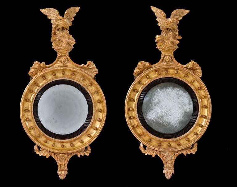 The original convex mirror plates have decorated borders and are well proportioned. The size is not rare but to have a pair is, as well as carrying the original gilt and gesso.