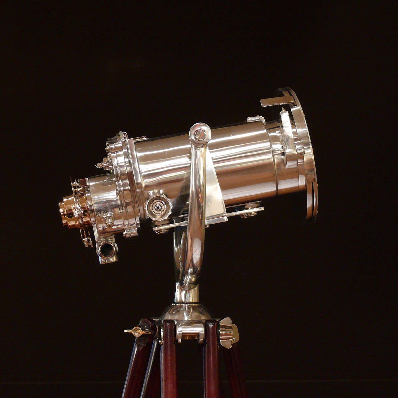 A splendid naval binocular gunsight with 10 power magnification and 70mm lenses by Ross of London, circa 1940. These binoculars have been stripped of their original paint and polished to a mirror finish, they have then been mounted on a period