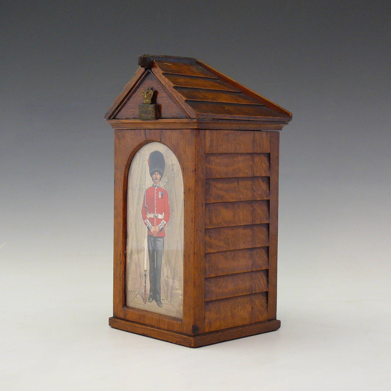 Oak Cigar Box modelled as a Sentry Box with watercolour of uniformed guardsman in his bearskin, by renowned military artist Richard Simkin. Circa 1890.

Dimensions: 11 cm (width) x 11 cm (depth) x 21.5 cm (height)

Bentleys are Members of LAPADA,