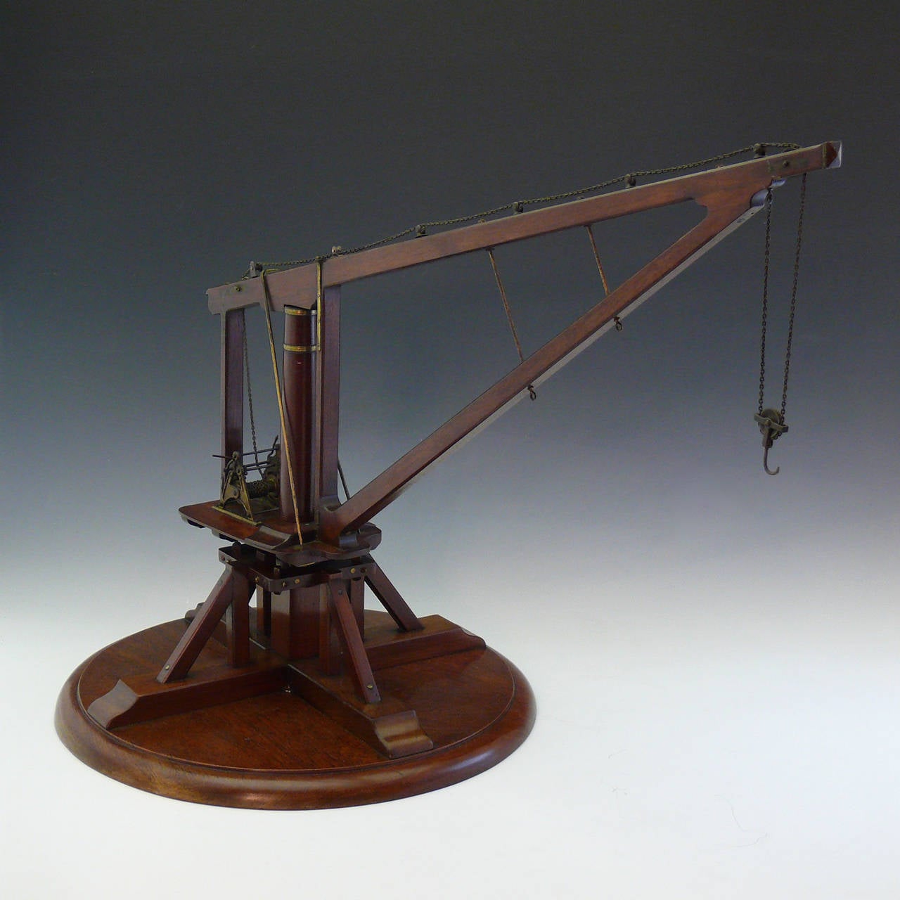 Unusual large-scale model of a late-Victorian crane, circa 1880. Beautifully constructed in mahogany with brass binding and details and the original working metal winch and chains, all perfectly scaled. The model is finely detailed and it could have