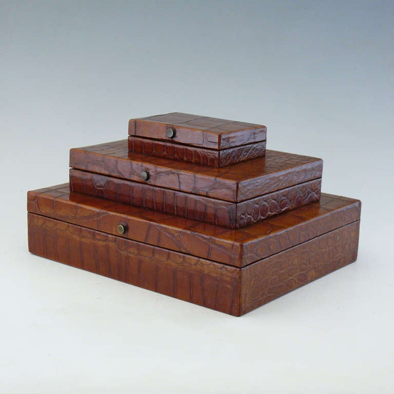 An exceptional crocodile skin smokers compendium set out as a triple layered box lined in Cedar, originally for matches, cigarettes and cigars. Circa 1900.

Dimensions: 16.5 cm x 12.5 cm x 9 cm
