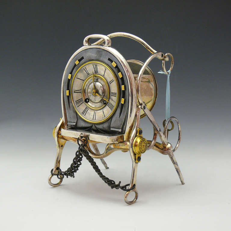 An unusual  equestrian themed French made nineteenth century clocks created from elements of horse tack including: bits, rings, buckles, chains, stirrups and stylised horseshoes, in various polished metals. Manufactured by the renowned clock making
