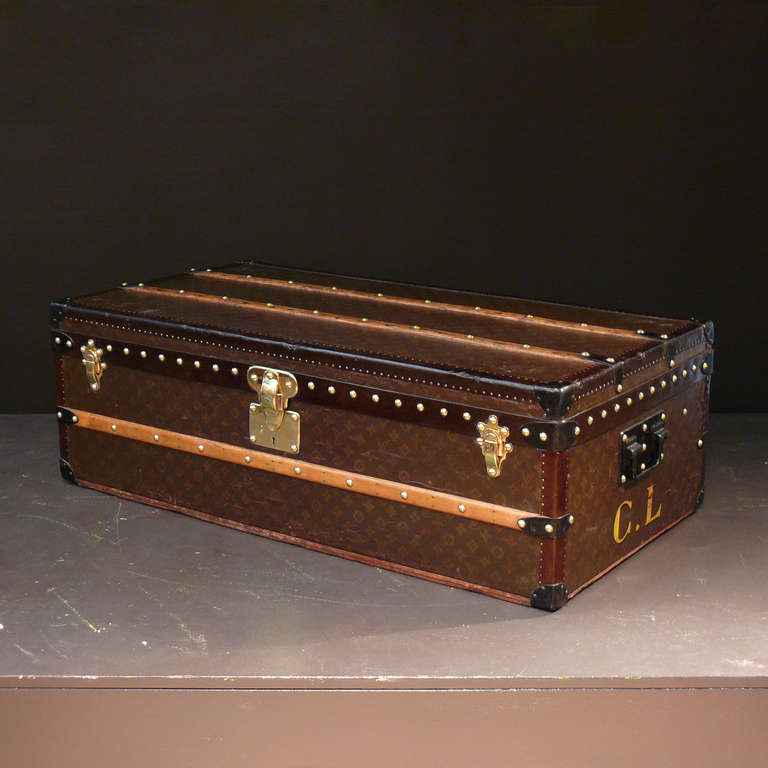 A steel bound Louis Vuitton monogram pattern cabin trunk, circa 1935. With brass lock and catches, dark lozine trim, 'Japanned' steel fittings and original tray. The interior of this trunk has been re-lined to match the original