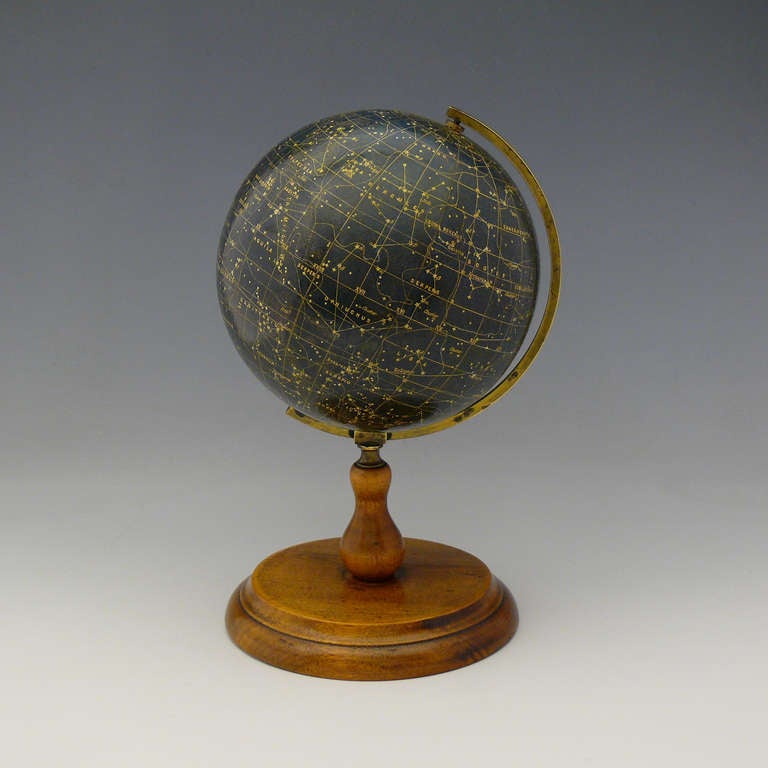 A splendid celestial globe by George Philip and Son on original turned wooden stand. Circa 1920.

Diameter: 14 cm, Height 23.5 cm
