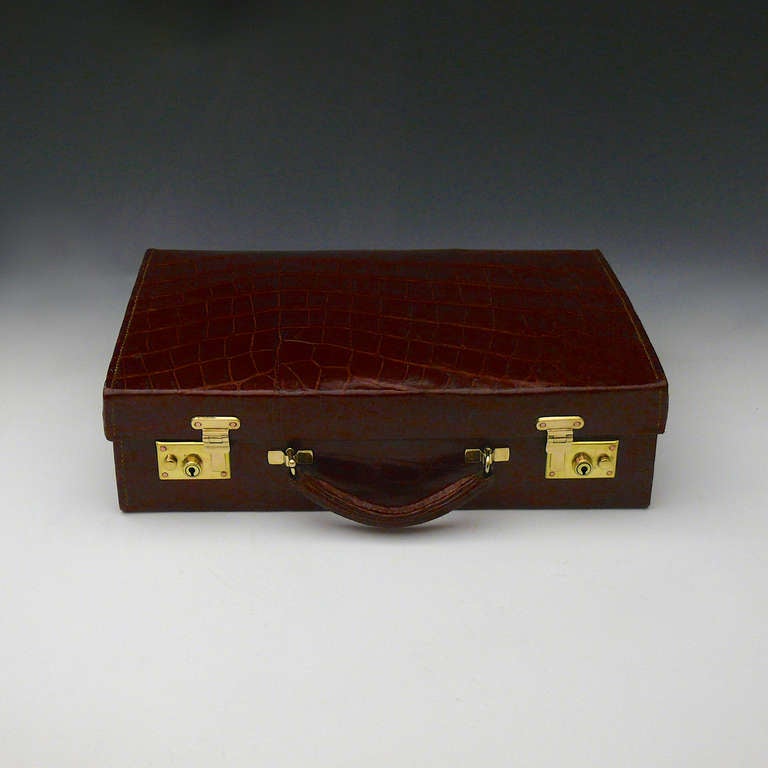 A magnificent crocodile skin attache case with interior relined in alcantara. Circa 1910.

Dimensions: 41 cm x 27 cm x 11.5 cm