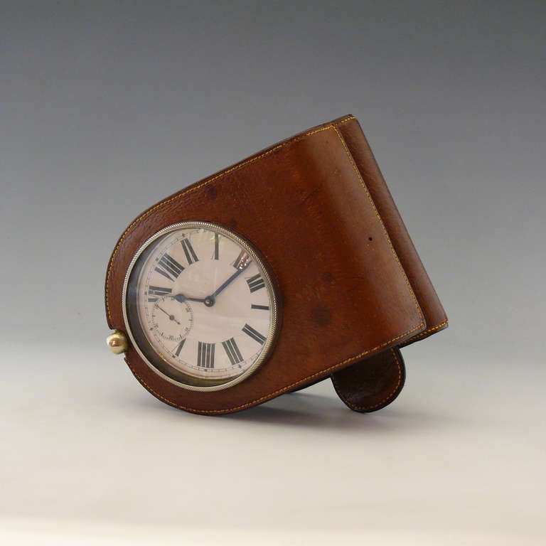 A splendid late 19th century leather cased goliath watch with tightly sprung clip mount for attaching the time piece to the foot plate of the coach and horses.

Dimensions: 7 cm (clock face diameter).

Member of LAPADA.