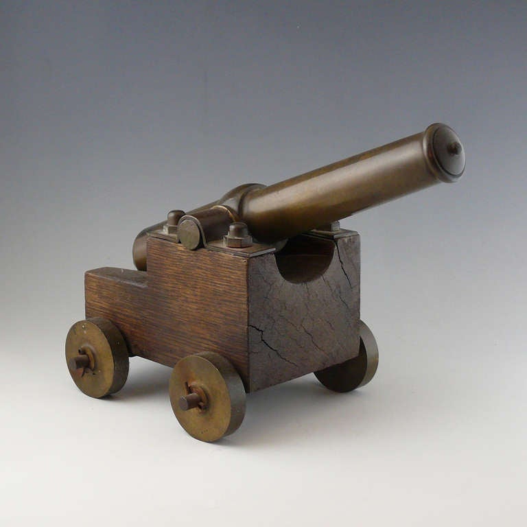 A fine small cast bronze yacht race starting cannon mounted on original oak carriage with brass wheels, circa 1900. 

Dimensions: 27 cm (canon length).

Member of LAPADA.