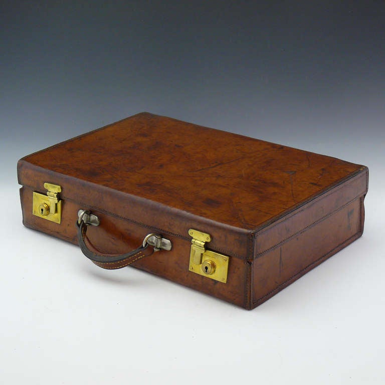 An unusual, exceptional quality, turn of the century leather attache case by Insall & Sons of Bristol in stunning condition. The lid is designed so that it does not project out over the body of the case at the corners. Has a replacement handle.