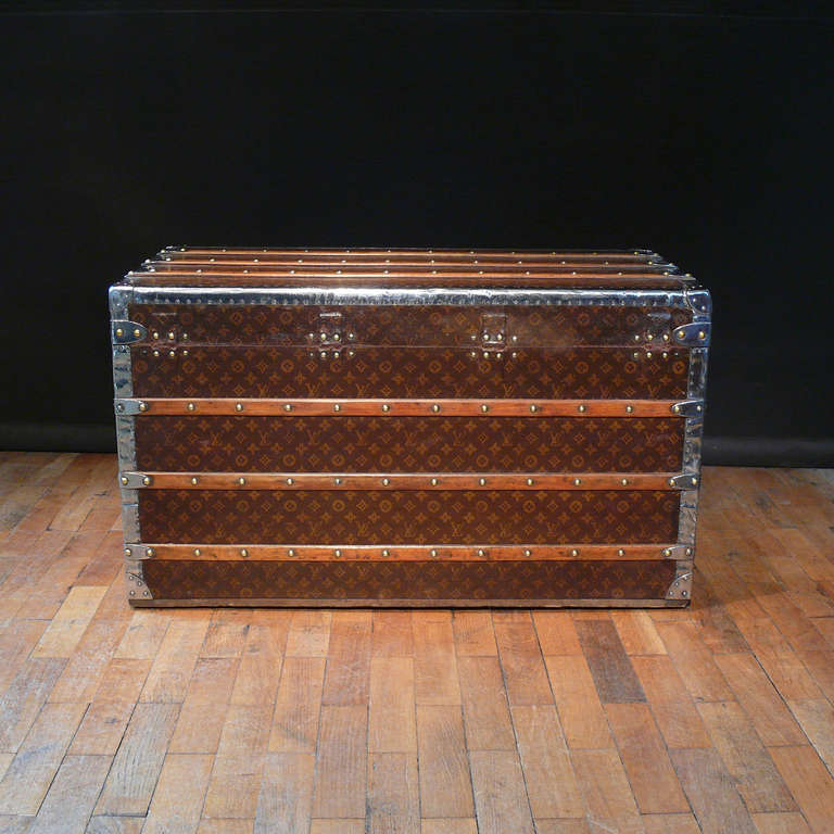 A rare Louis Vuitton monogram chest of drawers with front opening doors, brass locks, polished steel trim and handles, circa 1910. 

Dimensions: 100.5 cm (length) x 56 cm (depth) x 58.5 cm (height).