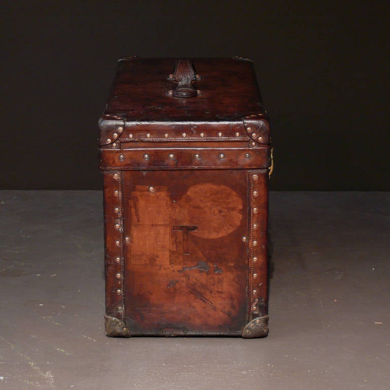 Nicely proportioned small size Louis Vuitton trunk with richly patinated leather covering with original cotton lined interior with tray in excellent condition and brass locks. Circa 1905.

Dimensions: 61 cm/24 inches (length) x 28.5 cm/11¼ inches