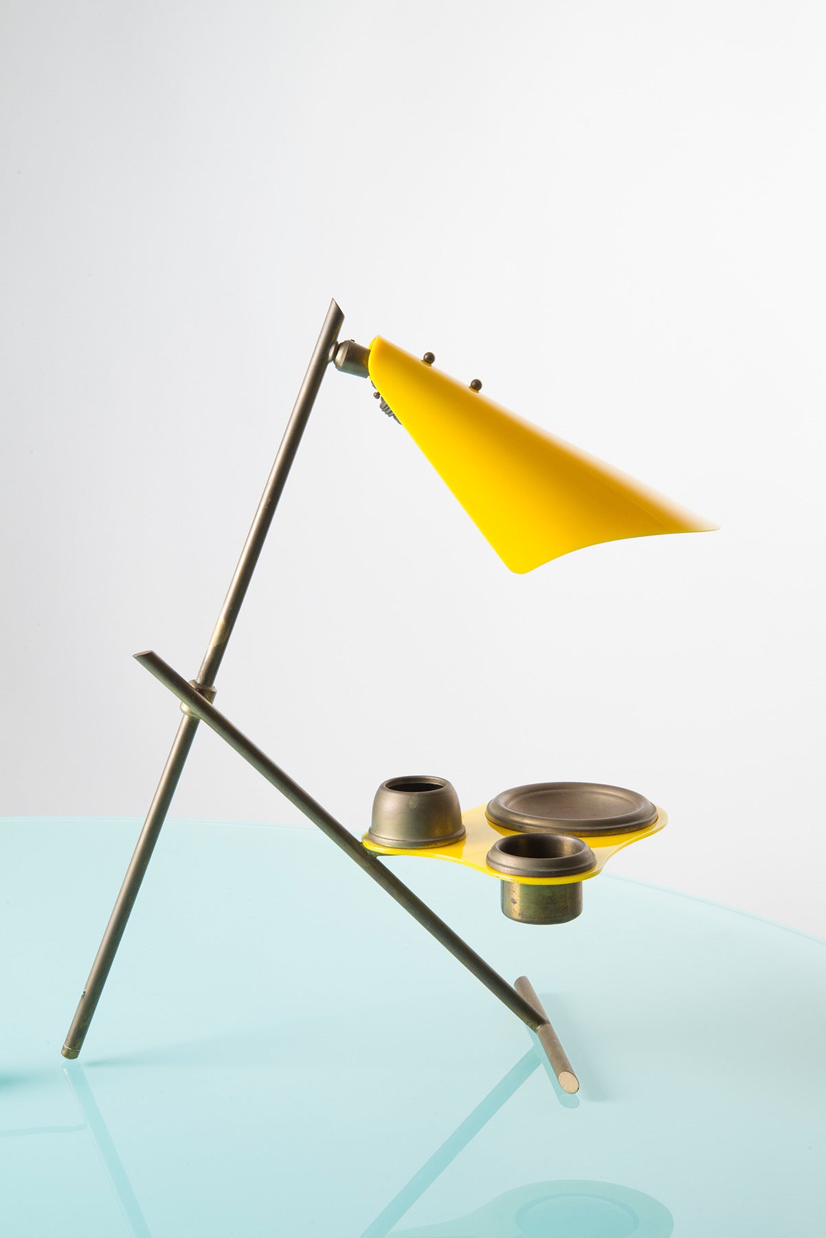 Inkwell lamp manufactured in Italy in the '50s. Yellow perspex shade and tray, adjustable brass structure.