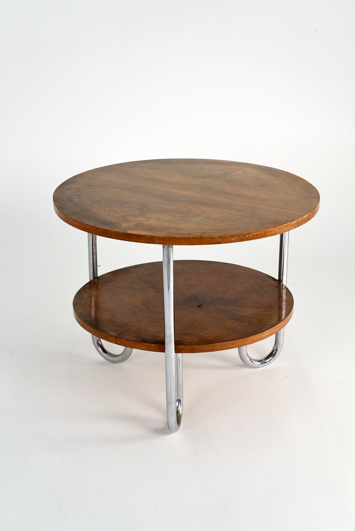 Rationalist coffee table manufactured by Columbus, Milan, in the '30s. Chrome plated tubular metal legs, wooden double top.