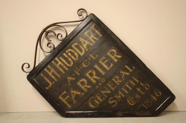 Original Antique Painted Hanging Farrier Sign.
This is a great English antique painted pine hanging sign, dating from the mid 19th century.
Painted on both sides this shaped shop sign would have originally hung outside a farriers, the lettering is