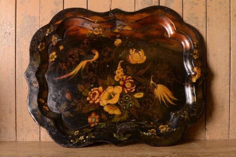 Large Regency Antique Pontypool Toleware Tin Tray.
This is a large sized, decorative hand painted toleware tin tray which has a shaped edge and is stepped .
Known as Pontypool work as it originates from that village in Wales, during the early 19th