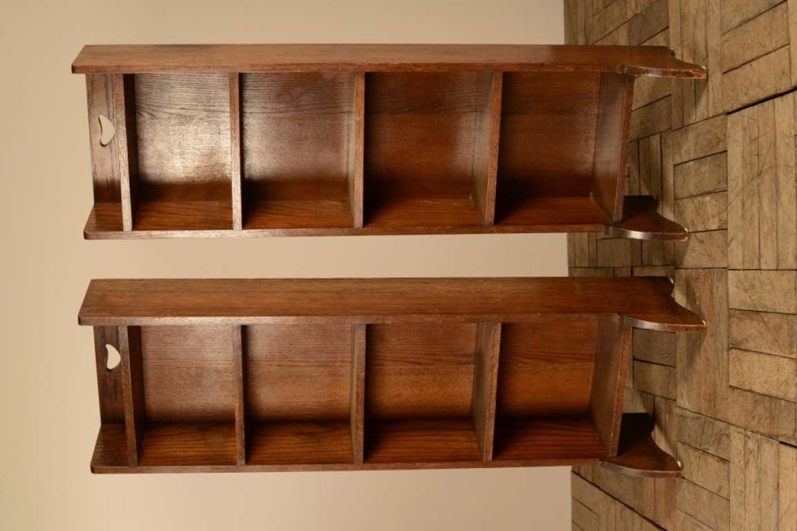 Pair of Liberty's Antique Oak Slender Bookcases.
This pair of tall and narrow, solid oak antique bookcases date from the late 19th century and are made and labelled by Liberty's of London.
In very good, solid condition and even n the correct,