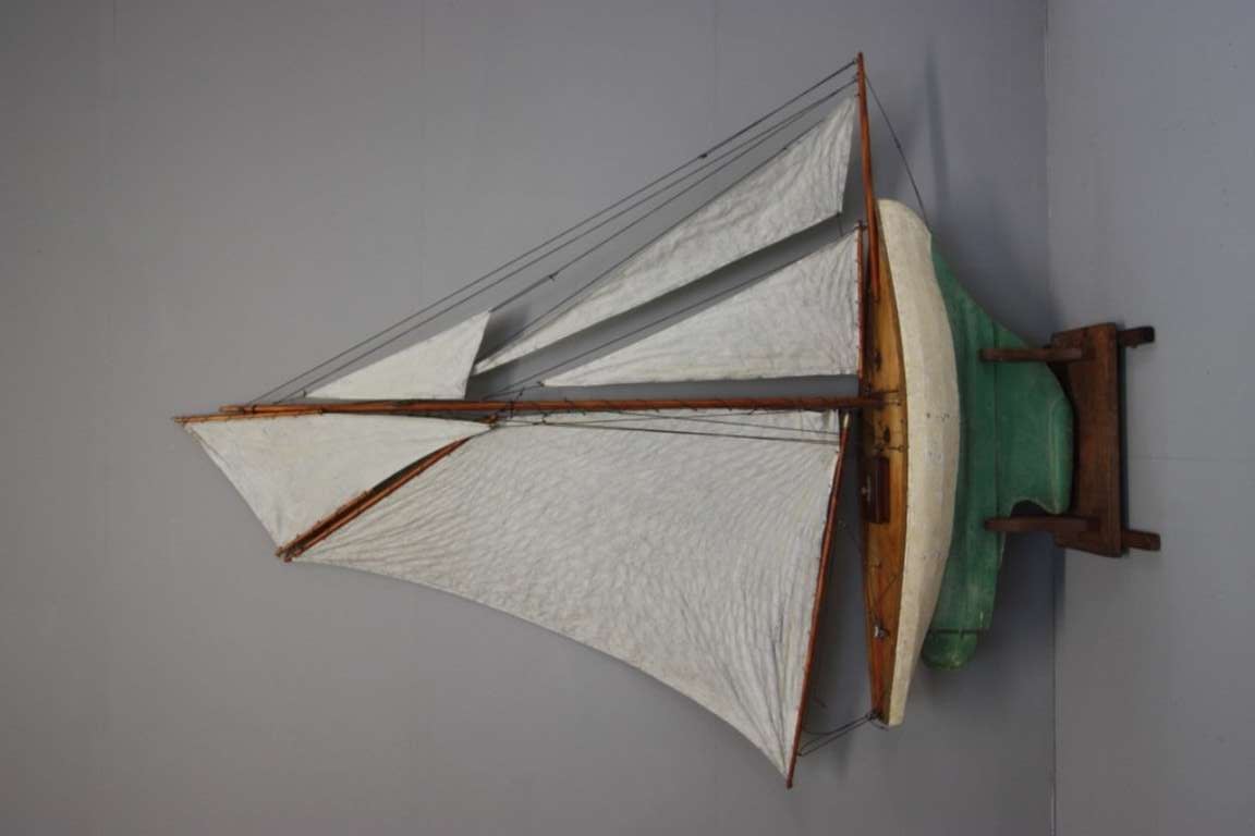 19th Century English Antique Pond Yacht.
A very decorative and fabulously well rigged antique pond yacht in the original paint finish.
This large antique yacht hull is well shaped and made in pine.
Complete with a display stand, this English 19th