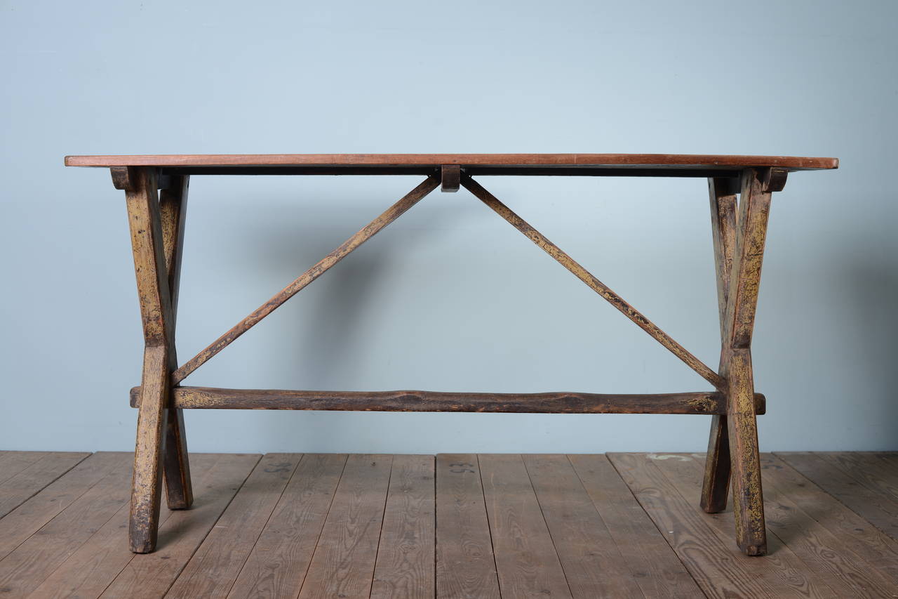 19th Century Cornish Antique X Frame Tavern Table.
This x frame style tavern table has a pine base which is in the original, worn paint finish.
The X frame ends are connected by a stretcher that has lovely, historic wear.
The original top is made