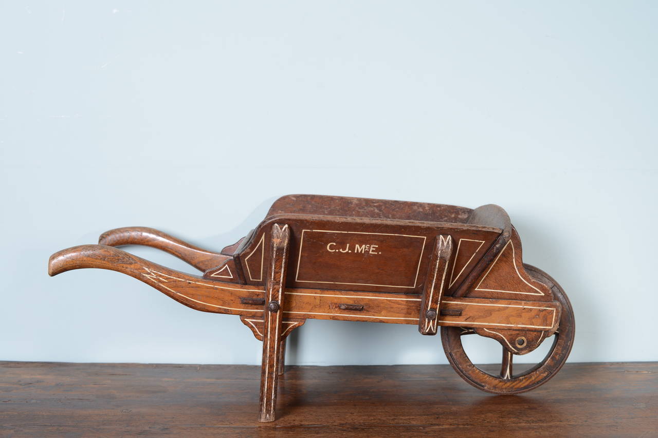 19th Century Antique Library Wheelbarrow in Original Paint.
A beautiful, English antique library wheelbarrow, in superb original condition.
Made in ash wood with the period paint finish and coach lined decorations.
In excellent condition and