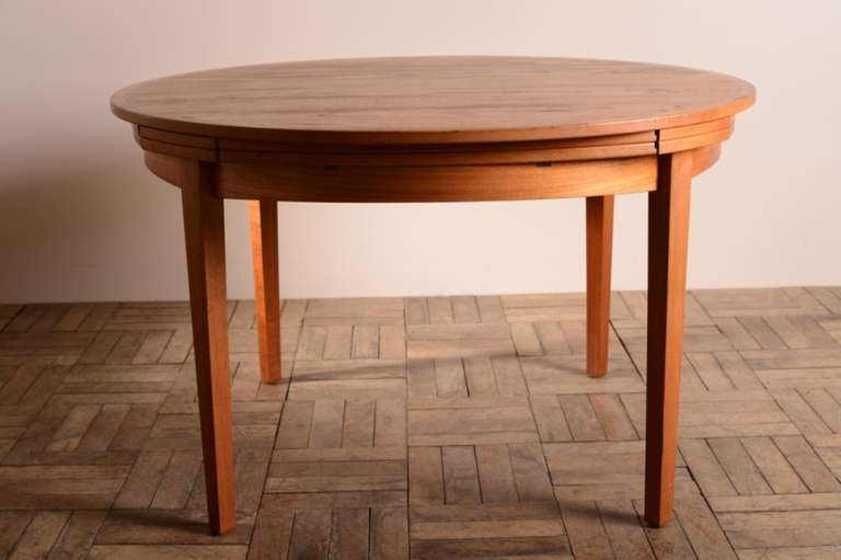 Danish Lotus or Flip-Flap Teak Dining Table.
This clever 1970's teak dining table by Dyrlund is made to a very high standard and is in superb, clean and original condition.
Labelled by the maker Drylund and stamped, made in Denmark, this patented