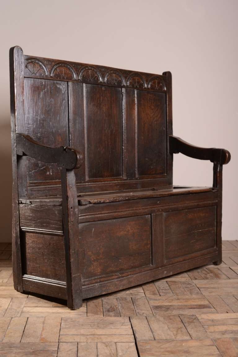 Early Georgian Antique  Box Seat Settle.
This period oak settle is a lovely, small size, it dates from around 1740 and features inventory initials stamped in places, this was very common in the 18th century as proof of ownership.
In very good