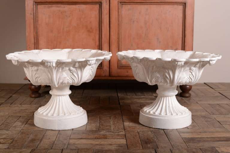 Pair of Elegant English Antique Cast Iron Garden Urns.
This pair of classically styled, 19th century antique urns are in superb, complete condition.
The wide bowls are perfect to mass display plants.
Dating from around 1870, the garden urns have