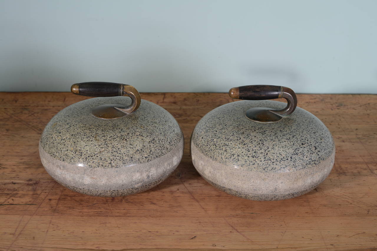 Great Pair of 19th Century Antique Curling Stones.
This pair of Scottish antique curling stones are in excellent, original condition.
Complete with their period, bronze and lignum vitae handles.
The curling stones are made from beautifully