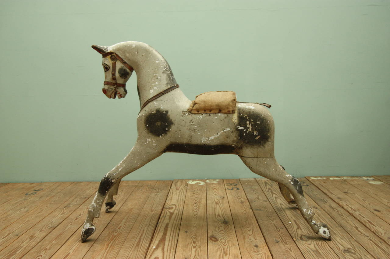 Large 19th century antique rocking horse.
This is lovely, English antique rocking horse, very well carved and still in the original paint finish.
In very original condition and complete with glass eyes.
A decorative English 19th century antique