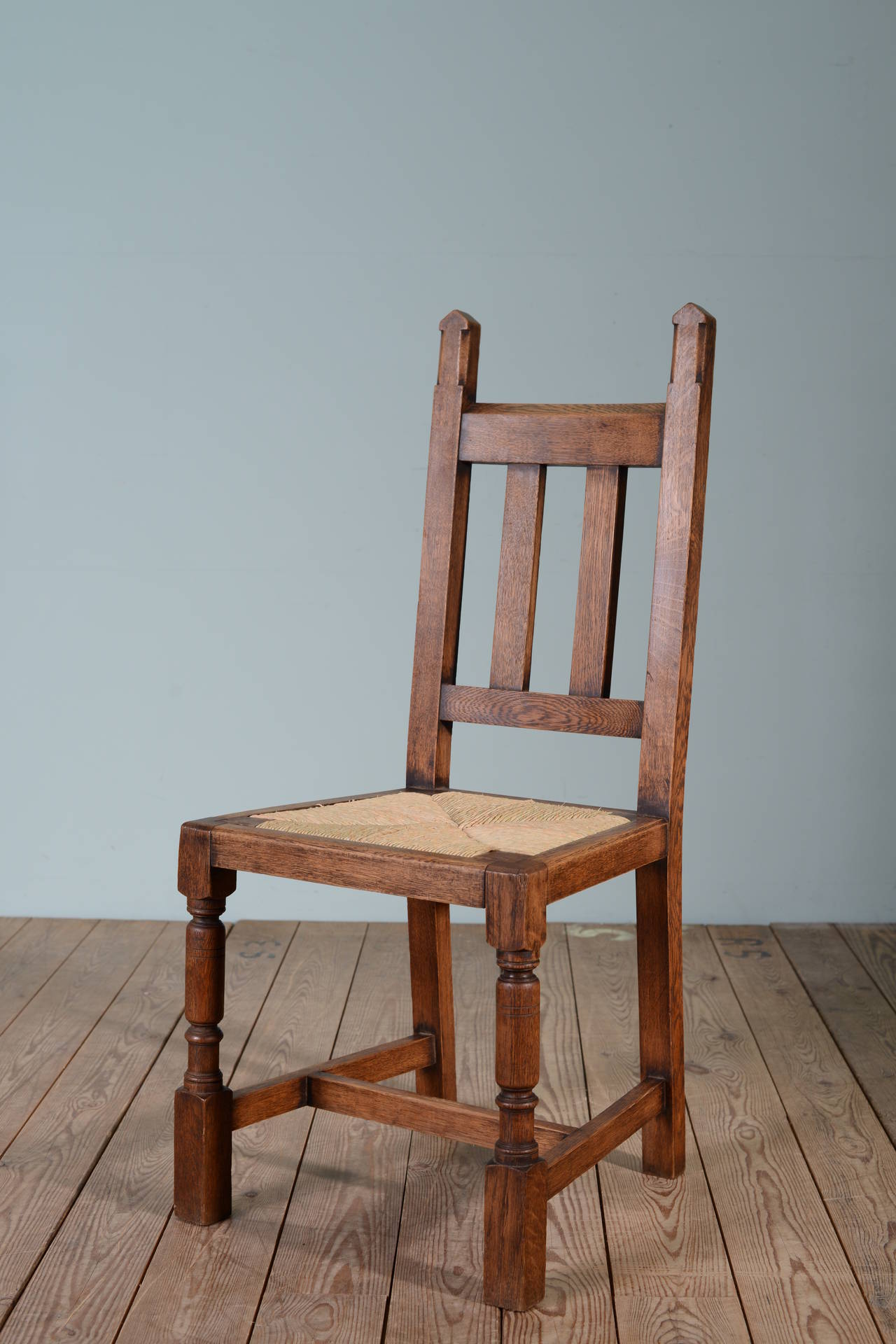 Set of Six Antique Culloden Oak Chairs by Liberty's.
This is a great set of English antique oak dining chairs from the Culloden range by Liberty's of London around 1875.
In excellent, clean condition, all the rush seats have been newly done.
A