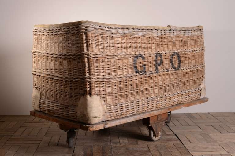 Huge GPO English Wicker Trolley on Wheels.
This is a fabulous, woven willow wicker trolley on large industrial wheels that work well.
Originally use by the General Post Office to move letters and parcels, the wicker is in strong, undamaged