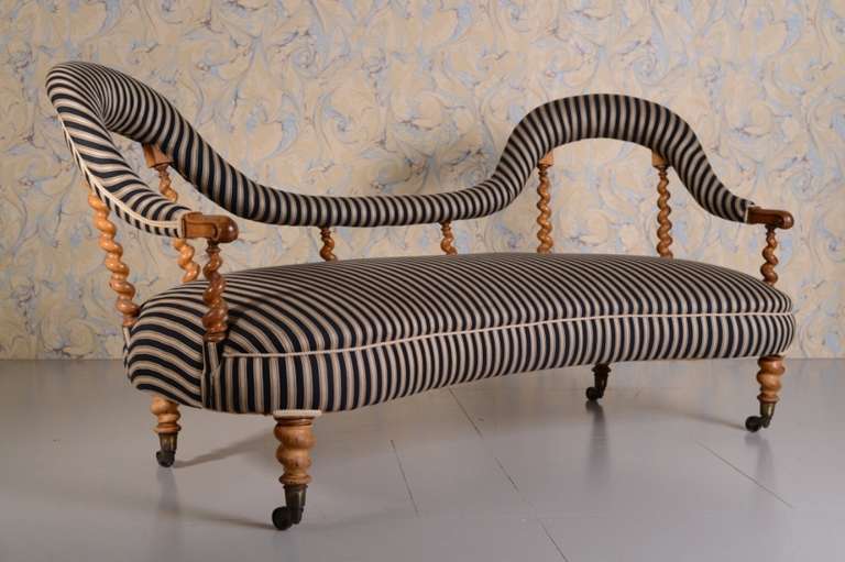 Very Shapely Satin Birch Antique Sofa.
This is a excellent quality, concave shaped, English 19th century antique sofa, a curvy design in solid satin wood birch, that is a beautiful colour.
Exceedingly well upholstered recently in a striped ticking