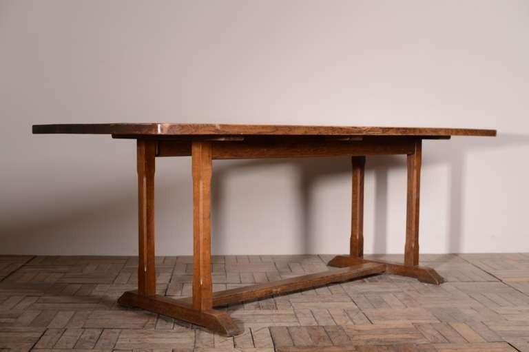 Large 1930's Heals Oak Refectory Dining Table.
This is a high quality, English oak dining table, by Heals of London.
The top is the most fabulous colour and shows lovely graining.
The refectory style table base has square and chamfered pillars