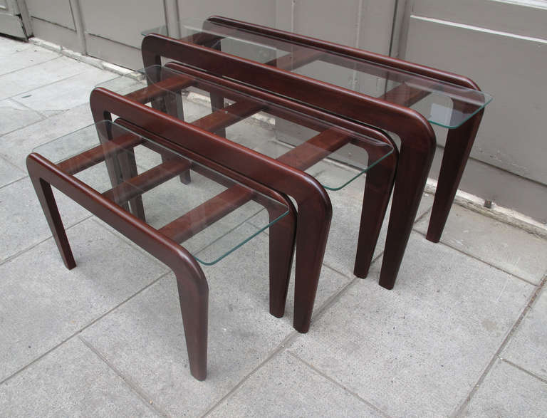 Gustave Gauthier 1911-1980
A set of three occasional table
Mahogany and glass top
H : 50 CM - L. 120 CM - D. 30 CM