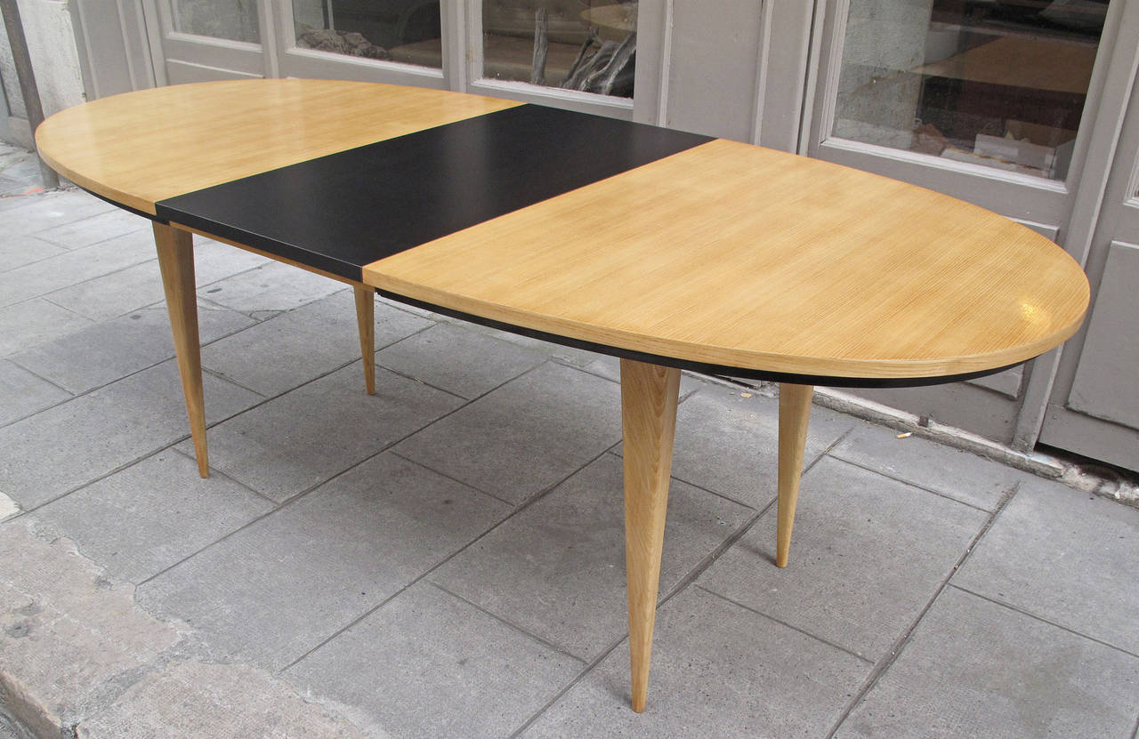 Charles Ramos,
A French extendable dining table,
Ash tree and black formica.
