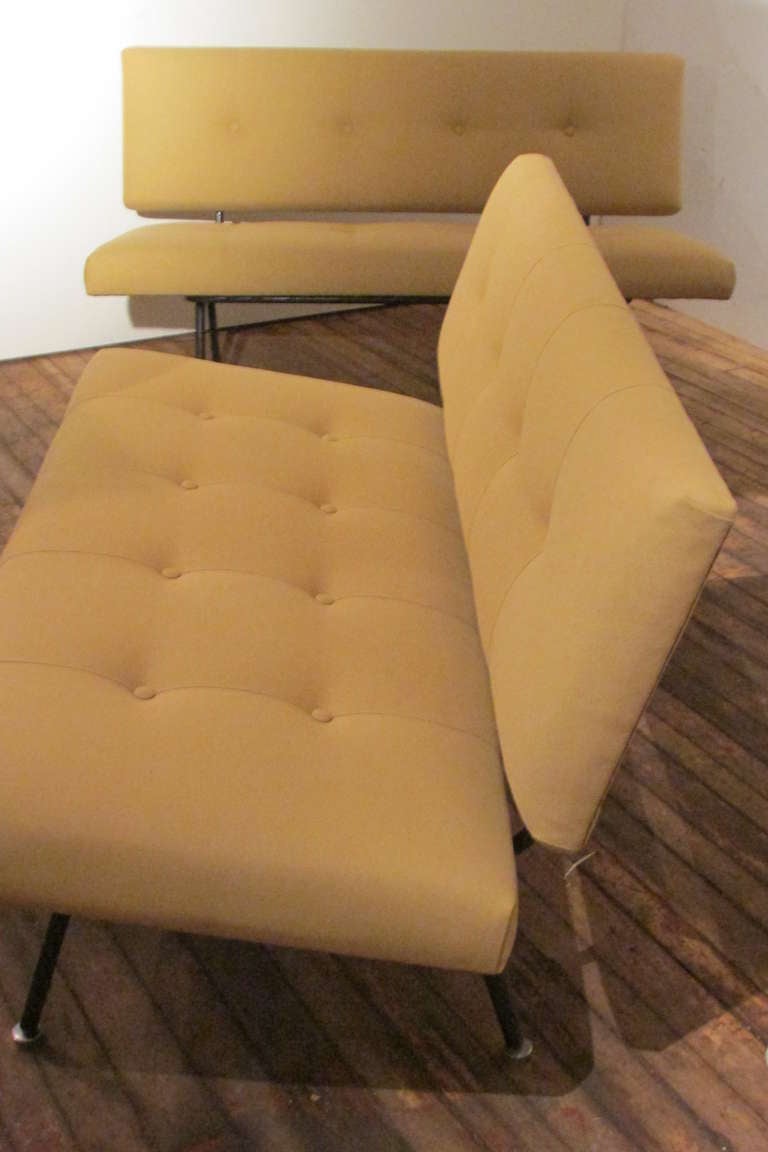 Hard to find early two seat sofas by Florence Knoll for Knoll Associates -  the seats & backrests refurbished with new foam & reupholstered in a high quality pale mustard color canvas twill fabric with top stitched button tufting. This model number