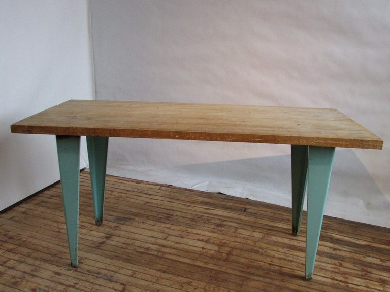 Industrial modernist maple butcher block top work table with boldy tapered metal legs in the original pale turquoise blue paint
