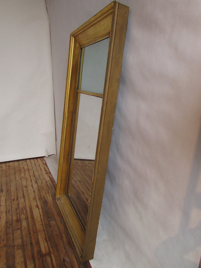 Very large and hard to find antique american split panel giltwood hall mirror. Big bold molding that is 5.5 inch wide & 4.25 inches deep. old mirror glass and old wood back boards. Orignal aged bright warm gilding over wood w/ gesso.