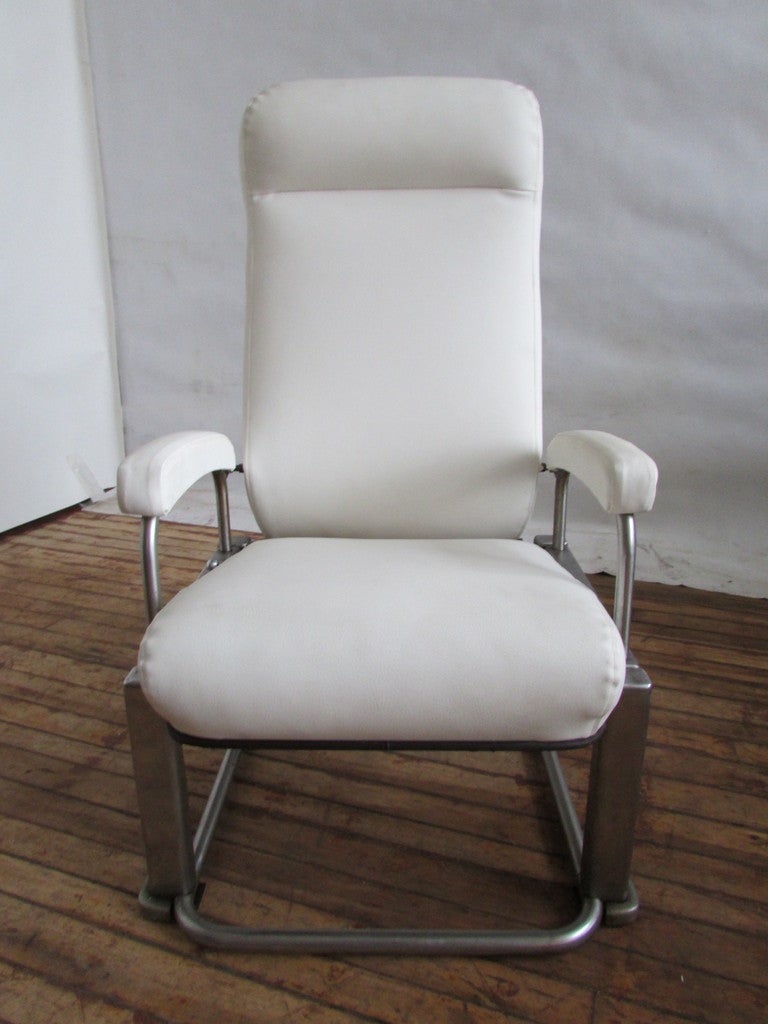 Industrial designer Henry Dreyfuss American Art Deco Machine Age metamorphic chair / table made for the Twentieth Century Limited Railroad of 1938.  The height of this chair when collapsed into table form is 13 inches.