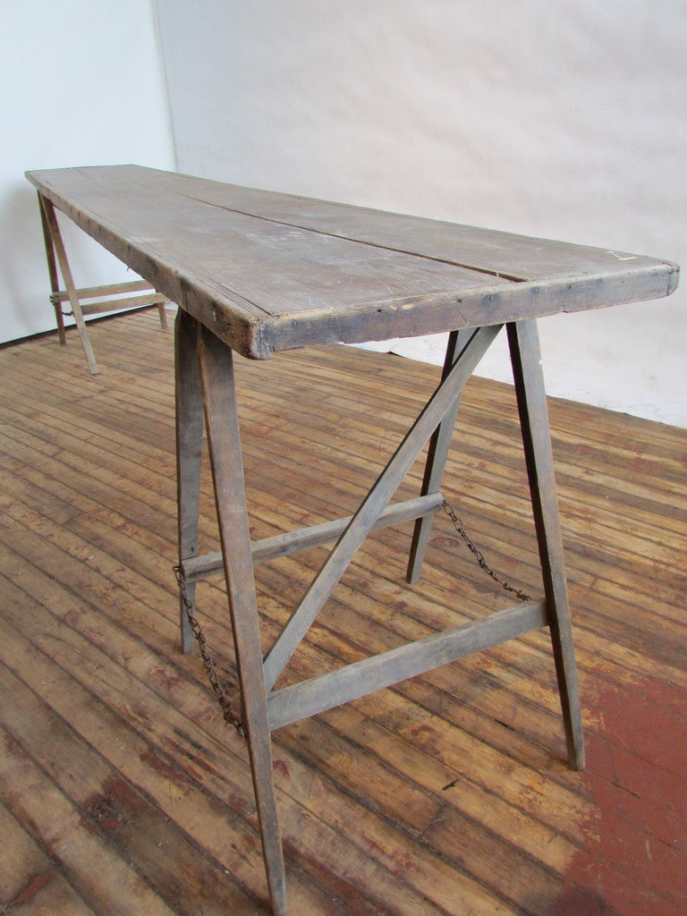 A hard to find extra long and narrow antique sawhorse base field table in old surface to wood -  ink stamped Flinn Parrish recently found in the Finger Lakes Region of Western New York State.