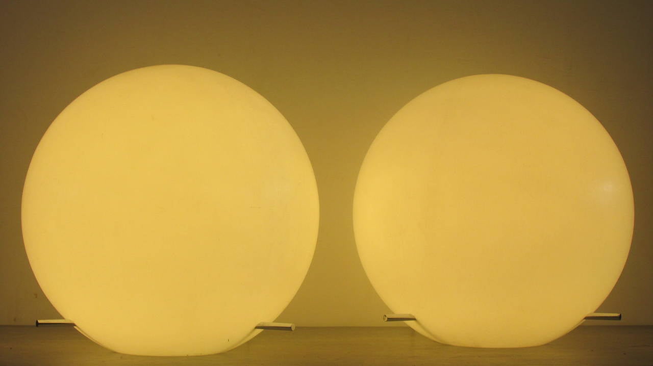 A pair of large white polypropylene ball table lamps with three protruding chrome metal rods at bottom, designed by Paul Mayen for Habitat Inc., New York City with original tags and long electric cords w/ on and off switches.