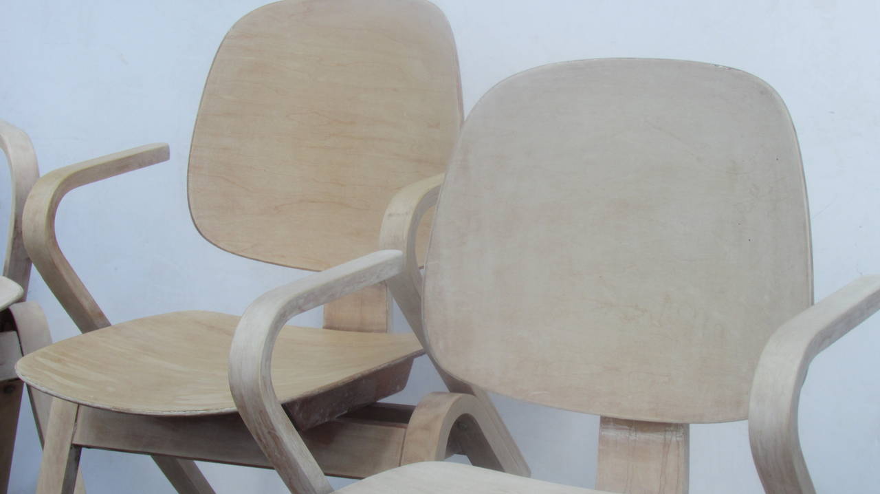 A set of four hard to find vintage Thonet bentwood armchairs designed by Joe Atkinson in a bleached pale parchment colored cerused finish, two chairs of the four are lighter with more of bleached bone white color. Paper labels present - Thonet - One