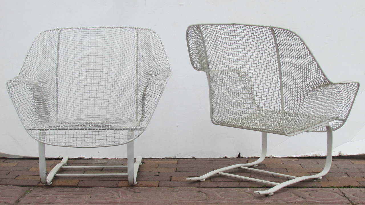 A vintage pair of the large size Russell Woodard Sculptura cantilever spring lounge armchairs in beautiful old white painted surface.