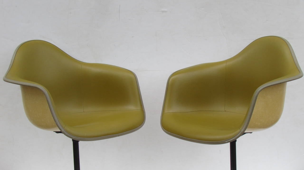 Eames Bucket Swivel Chairs in Alexander Girard Olive Chartreuse Naugahyde