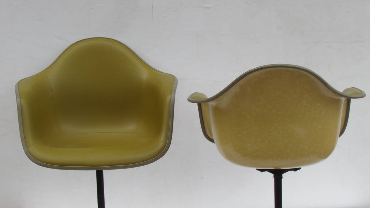 American Eames Bucket Swivel Chairs in Alexander Girard Olive Chartreuse Naugahyde