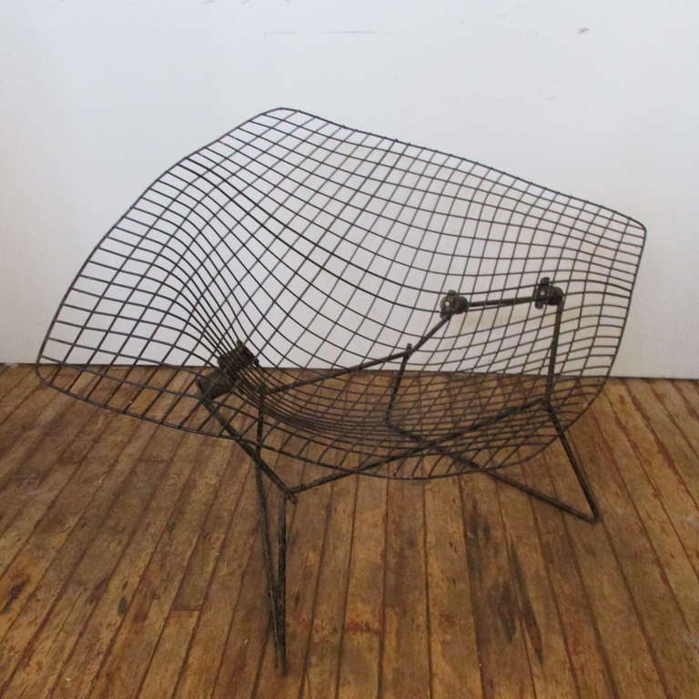 A large size diamond chair by Harry Bertoia for Knoll - this one looks to be from the 1950's.  We have the original purple thick fabric full cushion cover - it needs a good bath - we will include this in sale of the chair - if wanted by buyer.