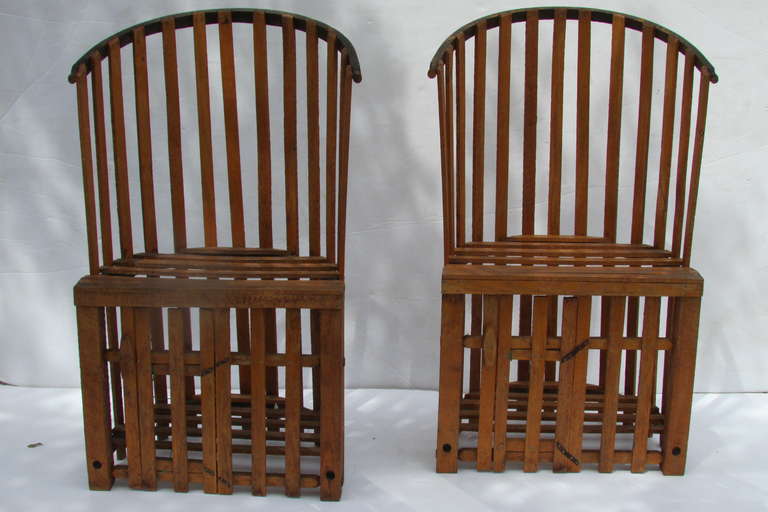 A very unusual pair of tall wood slat barrel chairs with beautifully aged patina & color. They were hand constructed from old lobster traps. Circa 1960 - 1970.