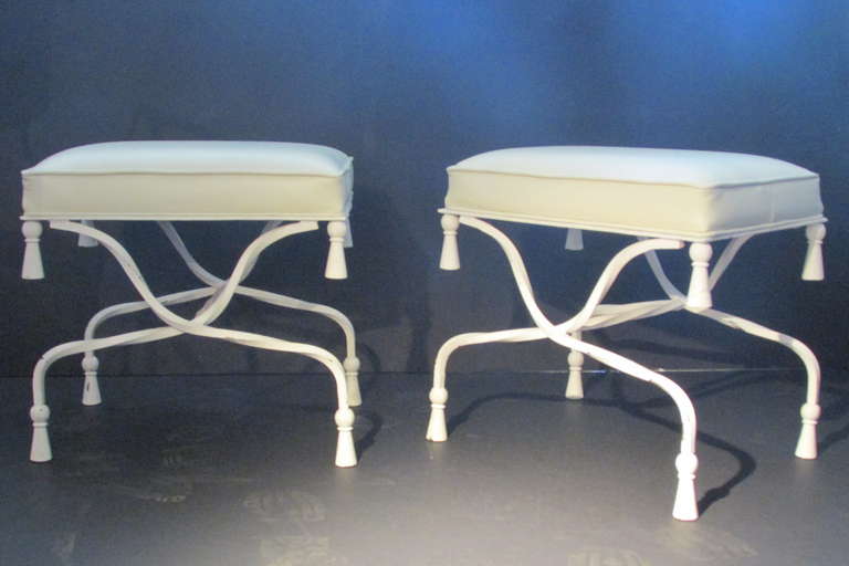 Solid iron painted tassel stools in recently upholstered high quality commercial grade soft cream white leather. Circa 1940s. Beautiful. Look at all pictures and read condition report in comment section.