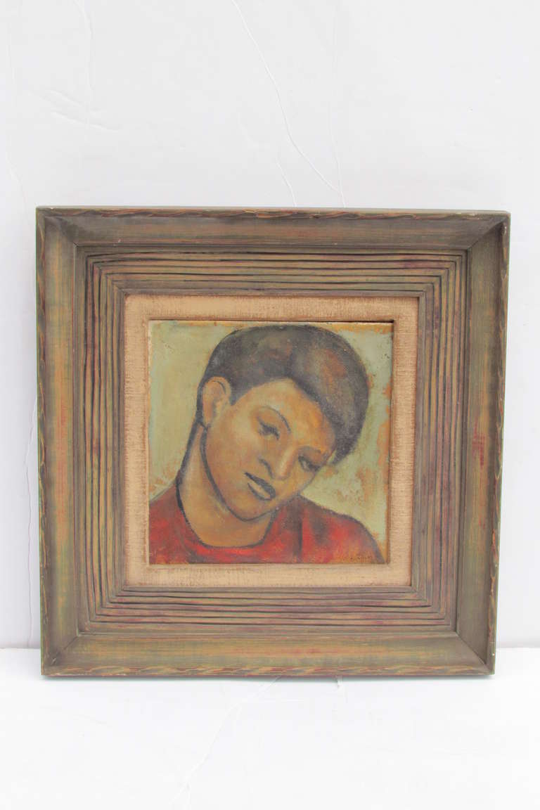 An oil on board portrait painting of a young boy in the style of the Mexican modernist art of Diego Rivera, It retains the original beautifully carved period wood frame. Illegibly signed at lower corner.
