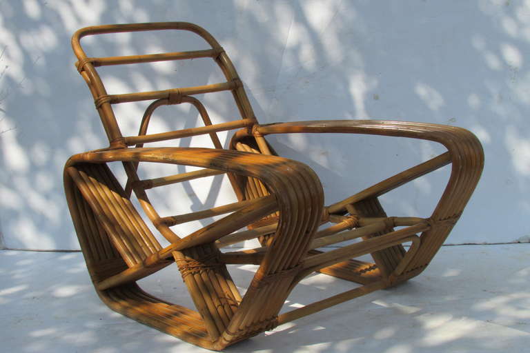 An unusual and oversize six band  natural rattan lounge chair designed by Paul Frankl. Made in Japan -1940's.