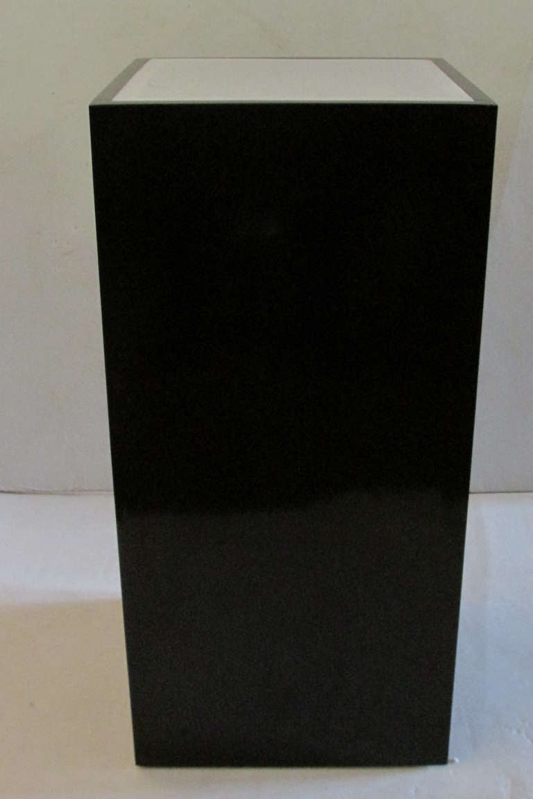 A black & white high gloss lucite acrylic illuminating floor pedestal dating from the 1970's - very good quality / great condition & in perfect working order